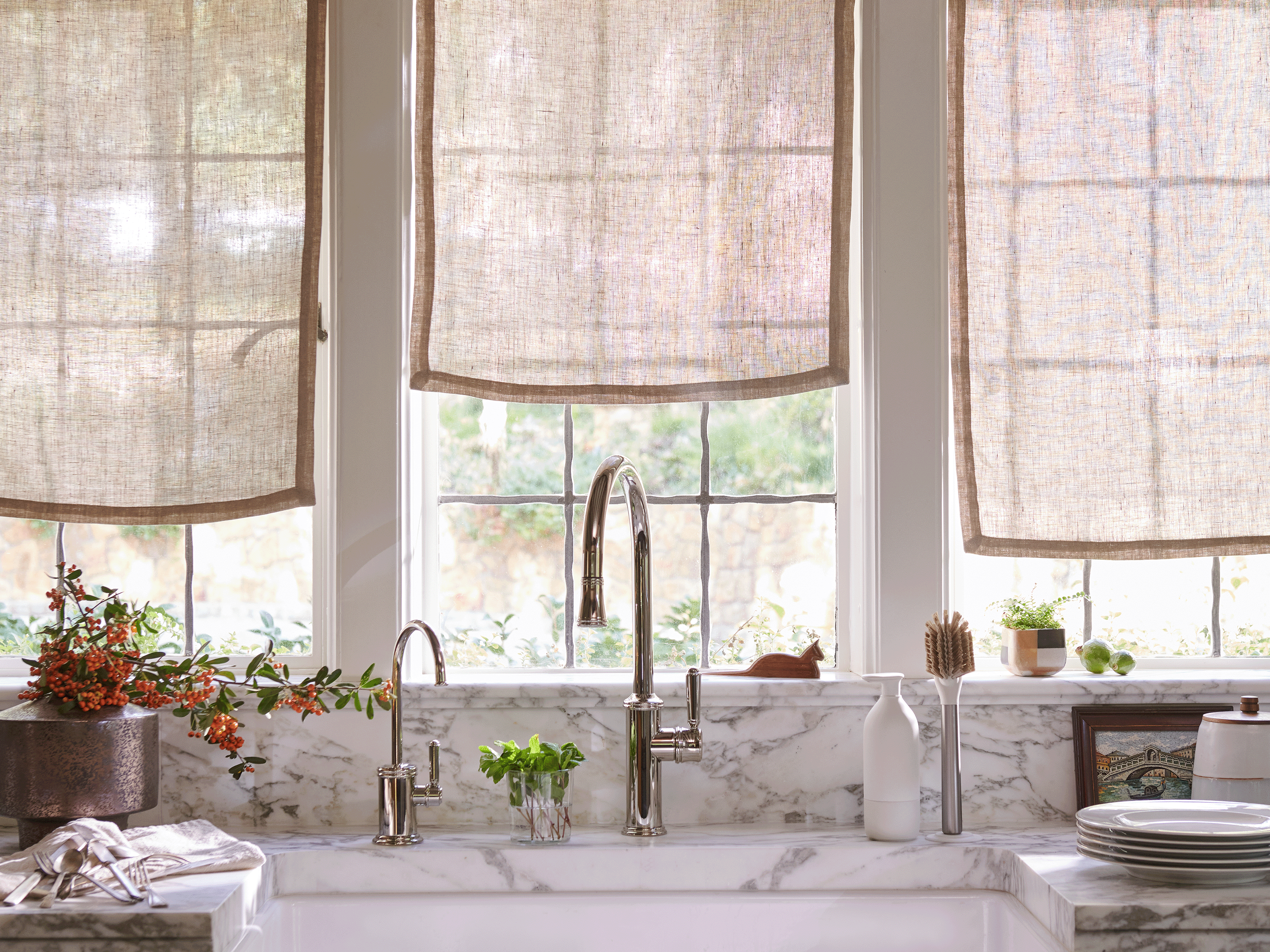 Modern kitchens sink with Curio Homegoods White Ionic Dish Brush standing on counter