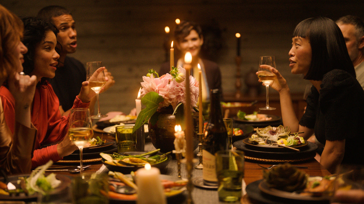 Friends talking at a dinner party