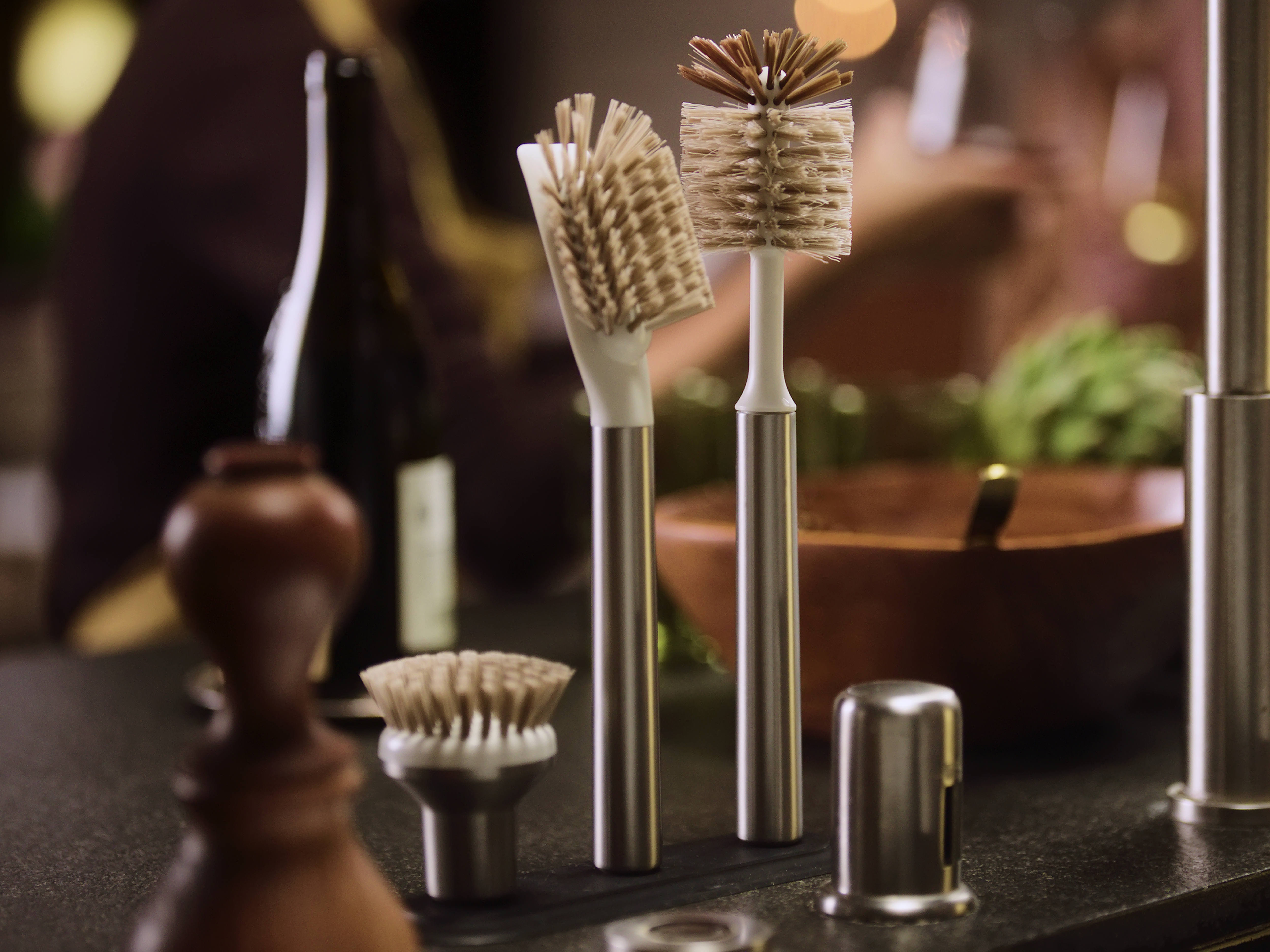 Curio Homegoods Ionic Brush Set in Stainless Steel standing on kitchen counter