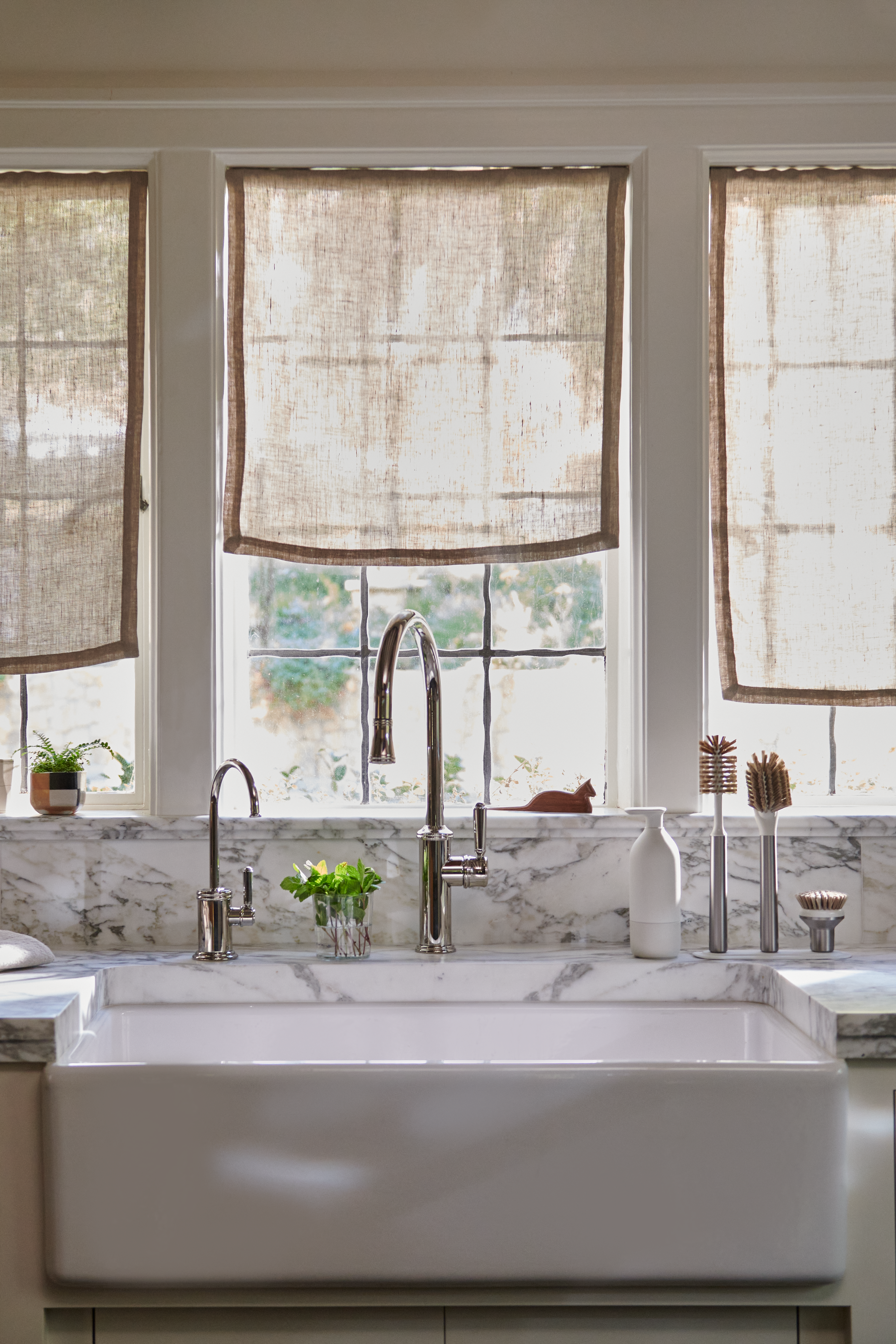 Modern kitchen sink with Curio Homegoods Stainless Steel Ionic Brush Set on counter