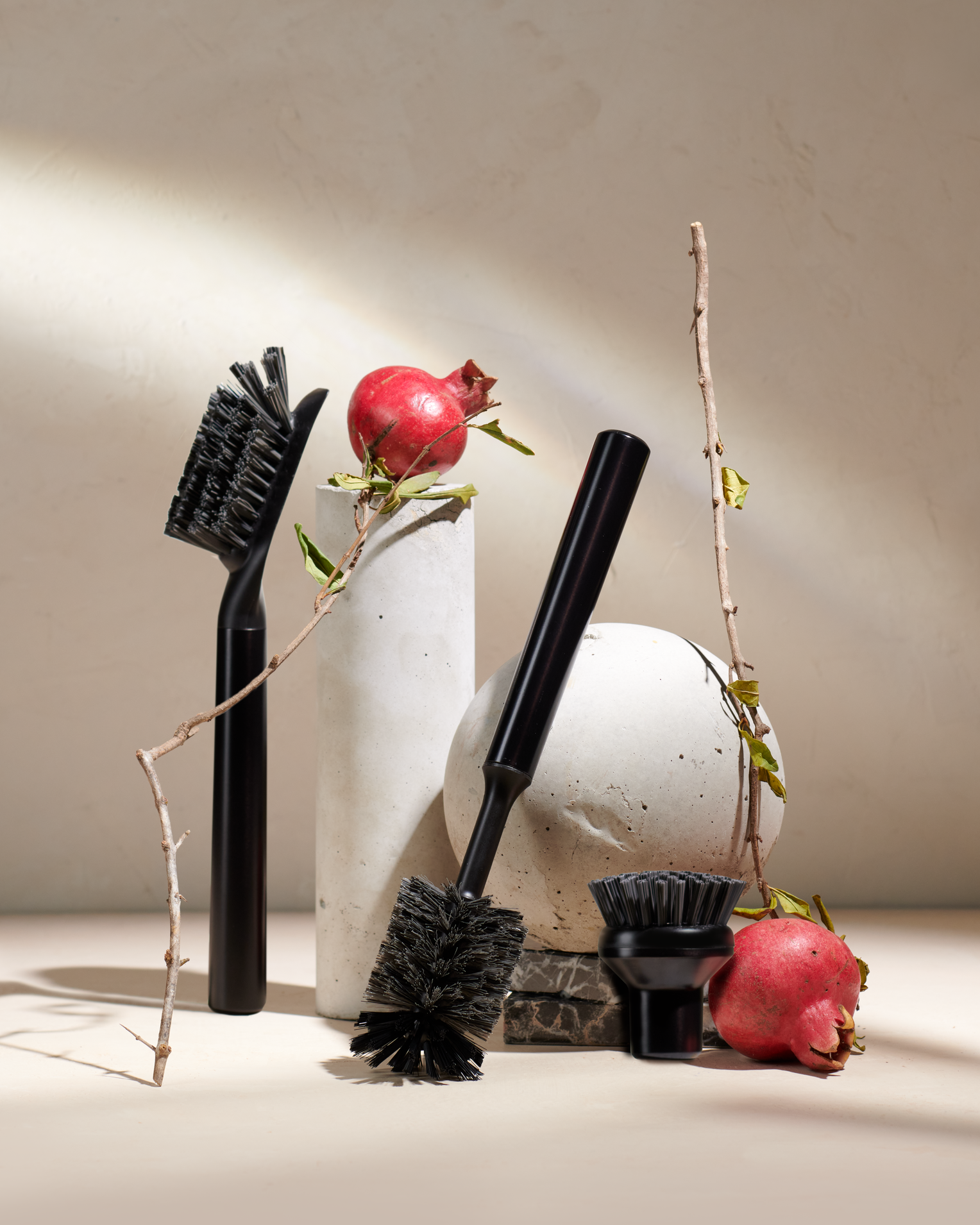 Curio Homegoods Ionic Onyx Brush Set among sculptures and fruits