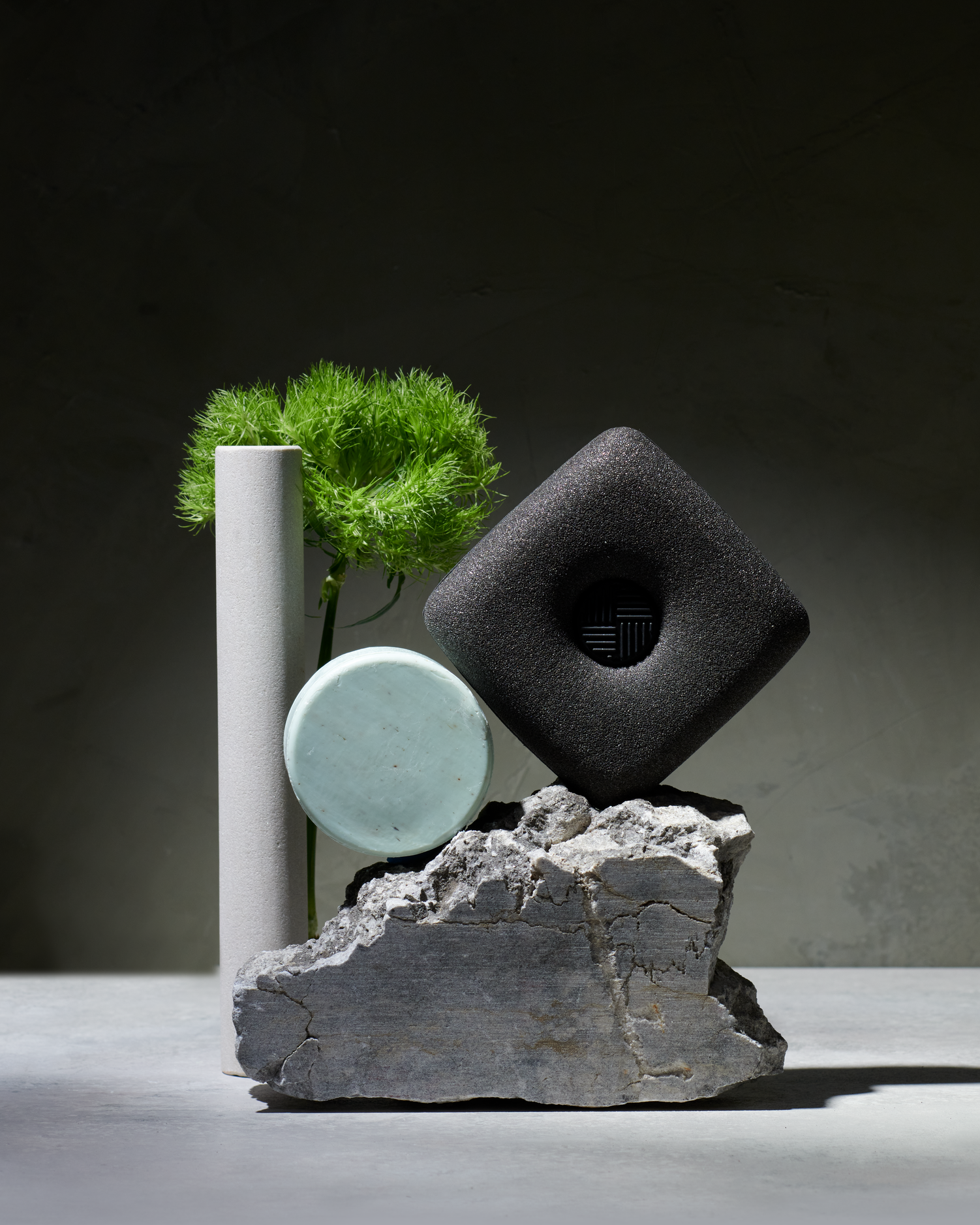 Curio Homegoods Ionic Counter Sponge with dark background and rocks